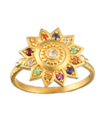 A Magic Hour Vibrant Self Multi Stone Lotus Ring crafted in 18kt gold-plated finish featuring a round center stone surrounded by intricately detailed triangular petals embedded with healing gemstones in green, red, blue, and clear. The polished, ornate design beautifully resembles a blooming flower.