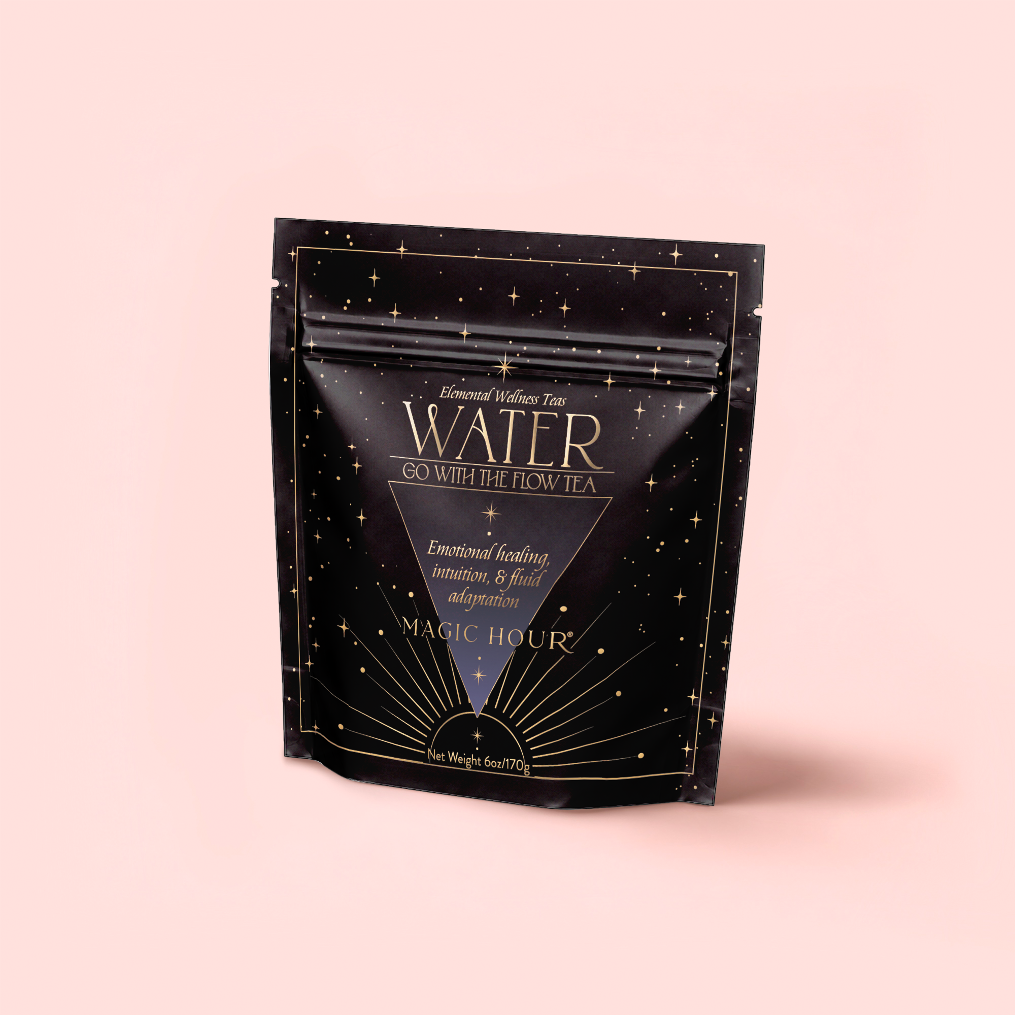 A black, star-patterned pouch of "Water White Tea: Soothing Lemon Balm Rose Reishi Tea for Going with the Flow" by Magic Hour stands upright on a light pink background, featuring gold accents and elegant text on the calming tea blend’s packaging.