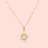 The 16" Blue Topaz North Star Necklace features a delicate 18k gold plated chain and a sun-shaped pendant with pointed rays, centered by a round, light blue topaz gemstone.