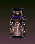 A dark purple "Monthly Magic Tea Journey Subscription" bottle with gold florals and a woman holding a crescent moon evokes a goddess ritual. The label reads, “She Rises—Flora in Bloom, Peach Moonlight White Tea.”.