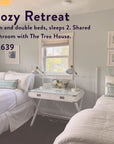 Experience The Soul of Tea: A Two Day Retreat in Ojai, CA—featuring a bright, serene room with twin and double beds dressed in crisp white linens. Enjoy the inviting atmosphere with a window between the beds, a desk illuminated by lamps, and curated art adorning the walls. This “Cozy Retreat” includes shared bathroom access and is available for $1,639. Elevate your getaway by savoring our signature tea blend—the perfect way to unwind after each day at this peaceful tea retreat.