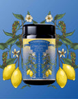 A black jar labeled "Teasoning: Lemon Pepper Lapsang" sits centered against a blue background, decorated with illustrated lemons, peppercorns, green leaves, and white flowers—spotlighting this unique smoky citrus botanical seasoning.