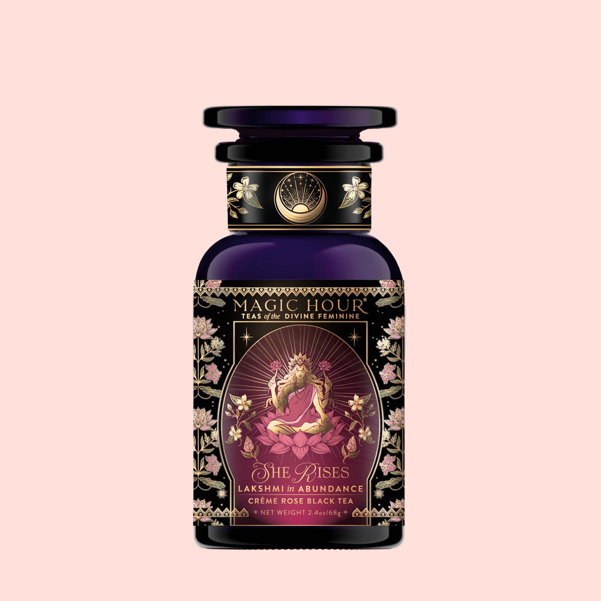 A decorative purple tea jar labeled “Monthly Magic Tea Journey Subscription” with an illustration of a goddess, floral patterns, and gold accents on a light pink background—perfect for elevating your goddess ritual tea experience or as an inspiring addition to your Divine Feminine journey.