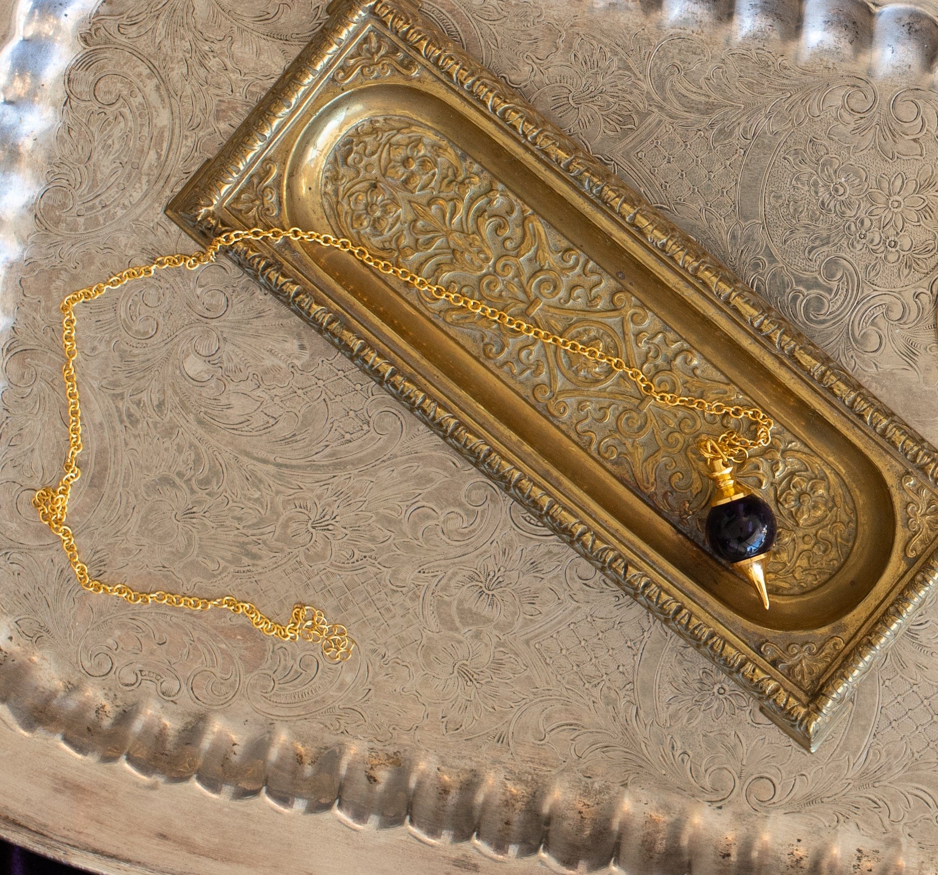 Amethyst Pendulum on gold tray